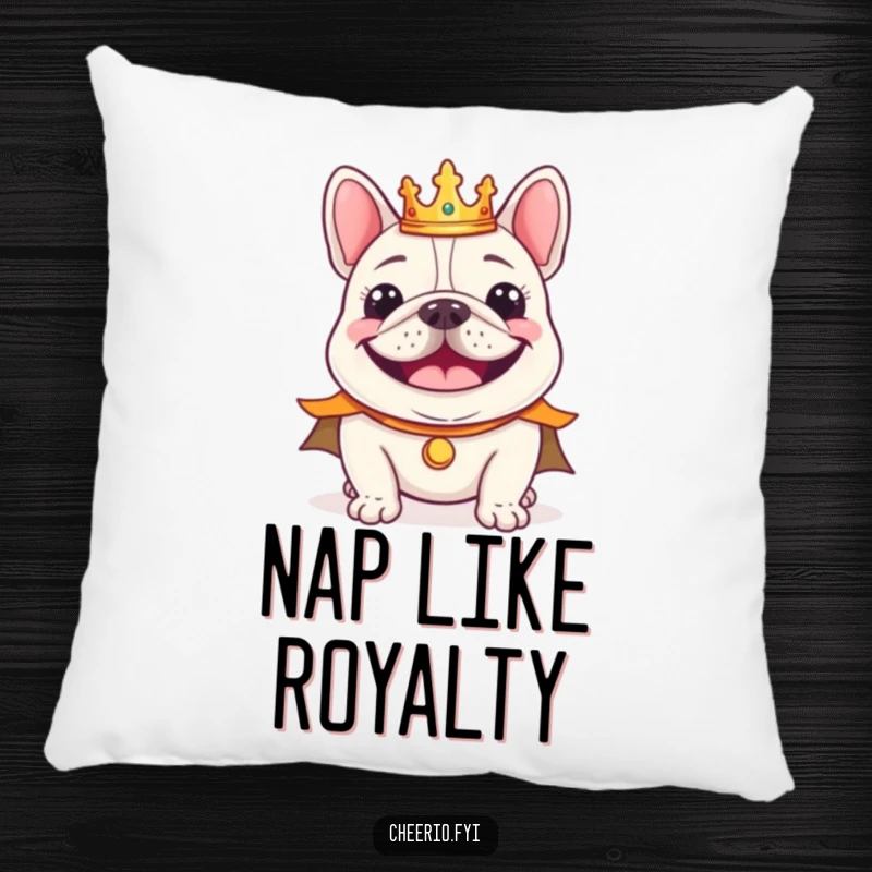 Funny cheerful bulldog wearing a tiny crown and regal cape smiling, a soft decorative pillow.