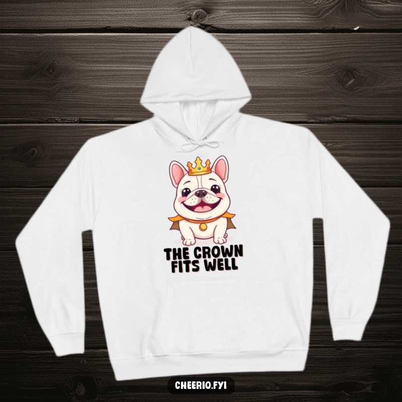 Funny cheerful bulldog wearing a tiny crown and regal cape smiling, soft and warm hoodie.