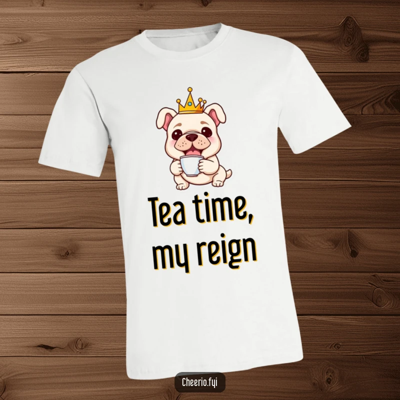 Funny t-shirt depicting a cheerful bulldog wearing a tiny crown and holding a miniature teacup, exuding playful regality.