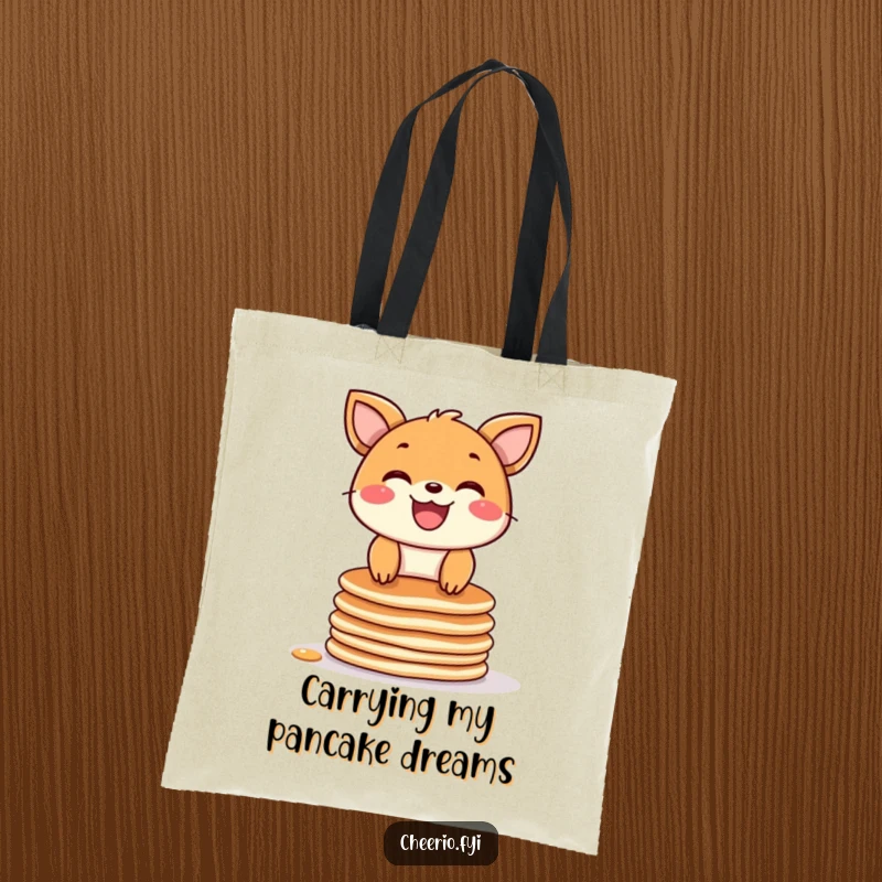 Funny tote bag with a joyful animal character showing a wide grin while balancing on a stack of delicious pancakes.